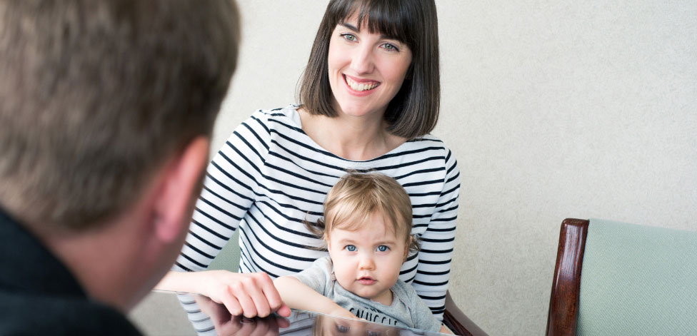 woman-with-child-in-office